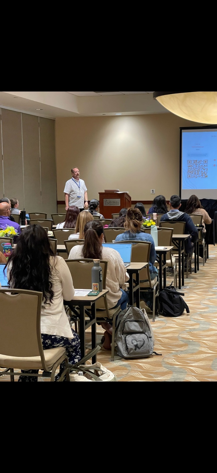 Dr. David A. Palmer speaking at an education event